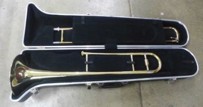 A Blessing USA trombone, cased, dented in some parts