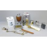 A collection of smoking items including cigar cutter, lighters, pipe cleaners, etc.
