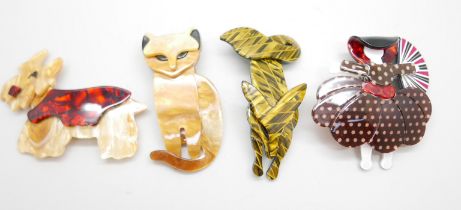 Four Art Deco style lucite brooches