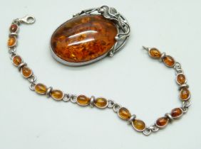 A silver and amber brooch and bracelet