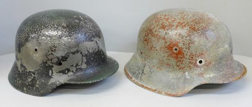 Two German WWII M40 and M42 helmets