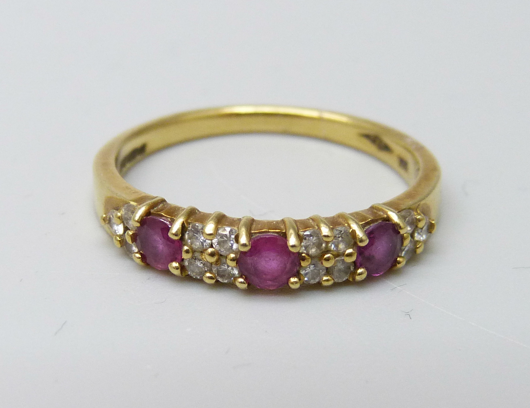 An 18ct gold, ruby and diamond ring, 2.9g, N