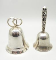 A silver bell with pierced handle and one other bell