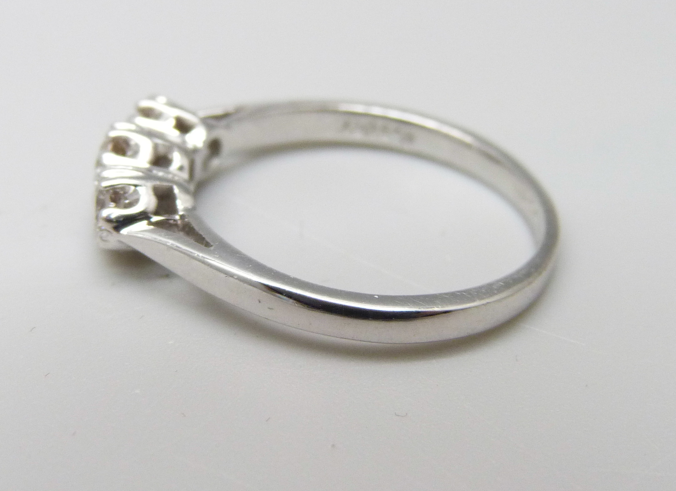 An 18ct white gold and diamond trilogy ring, 0.5ct total diamond weight marked on the shank, 3.2g, O - Image 2 of 3