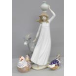 Two Royal Crown Derby paperweights and a Nao figure of a girl with goat