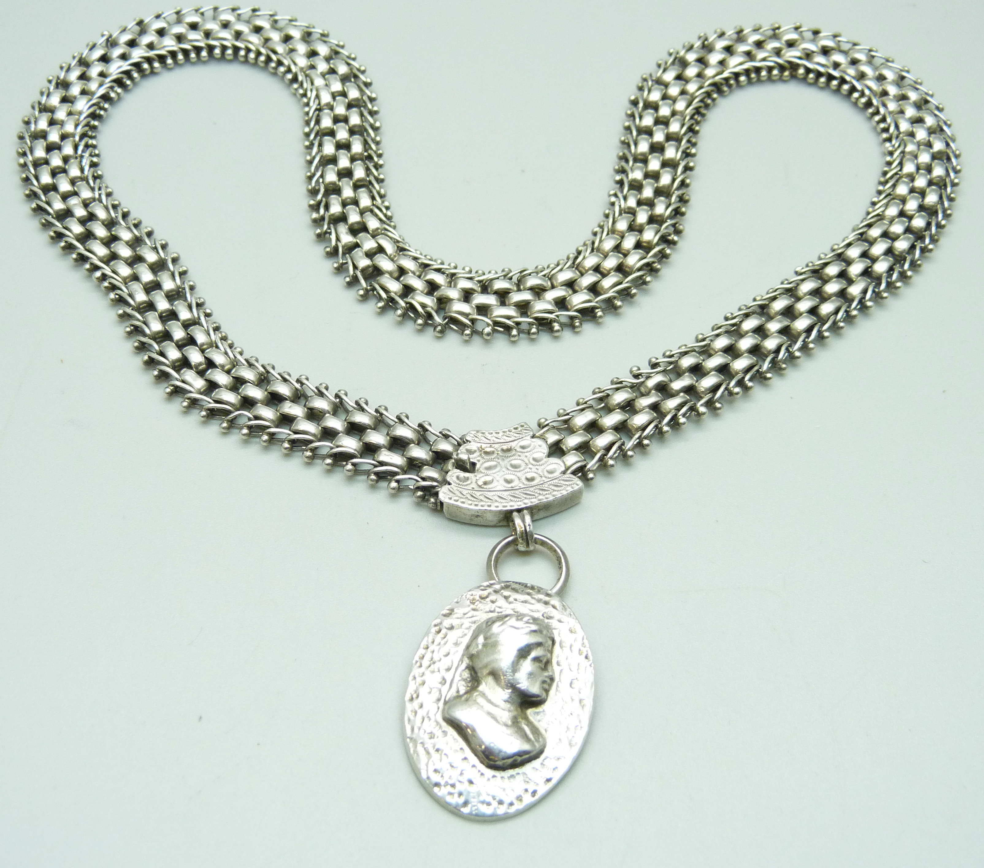 A silver Aesthetic style collarette and pendant, 62g