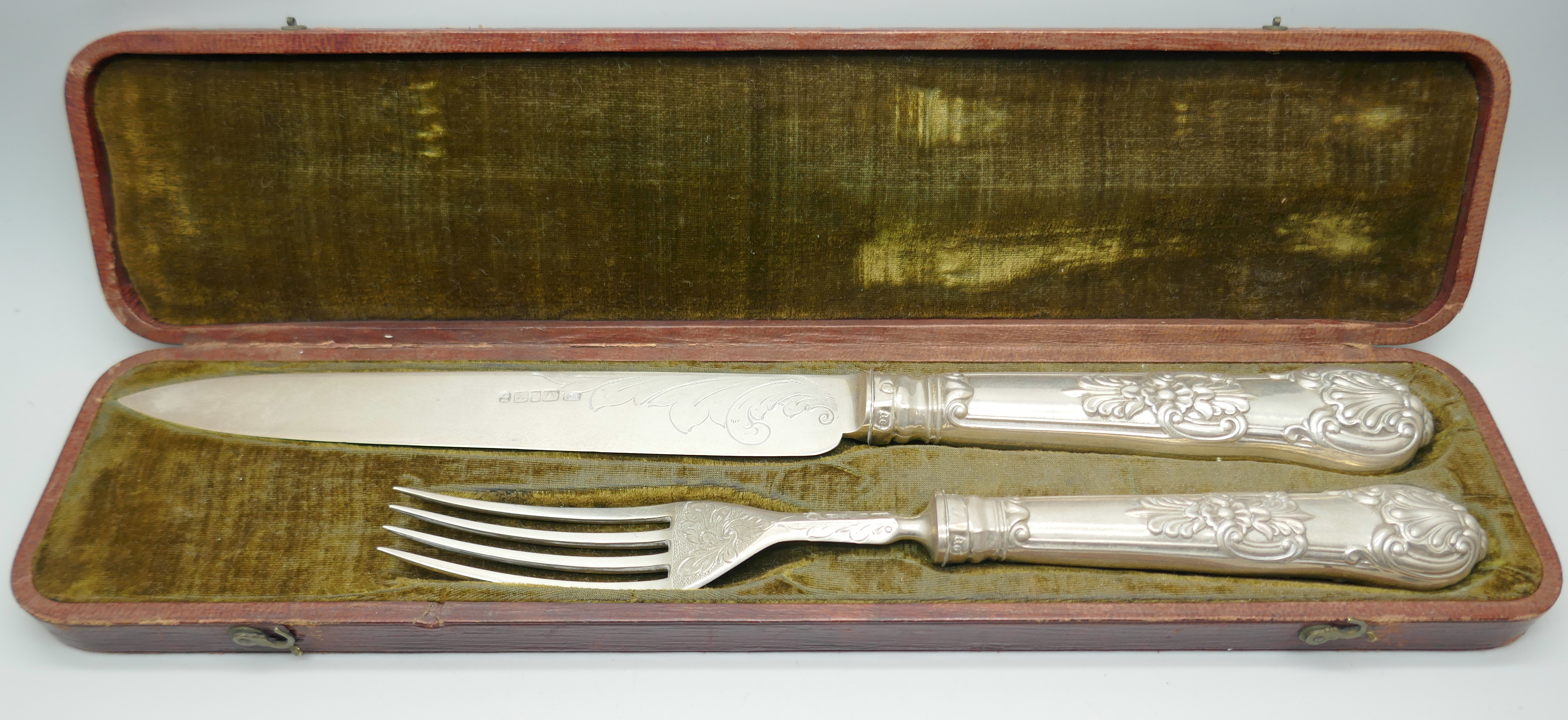 A 19th Century silver knife and fork in a fitted case, Sheffield 1835, outer box a/f