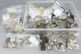A large collection of watch parts, dials and cases