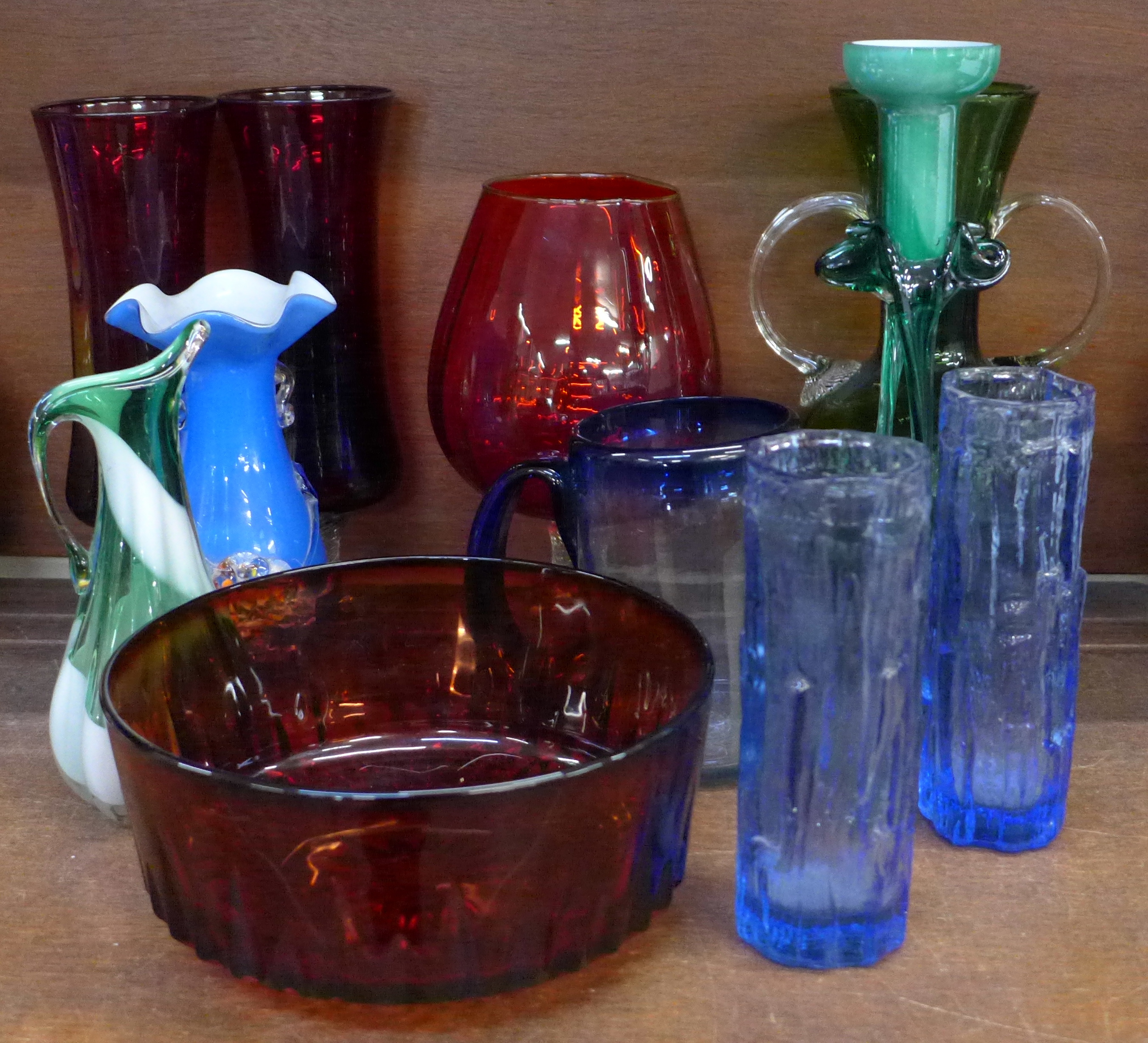 A collection of coloured glass including a hand blown mug, other hand blown pieces, etc. (11)