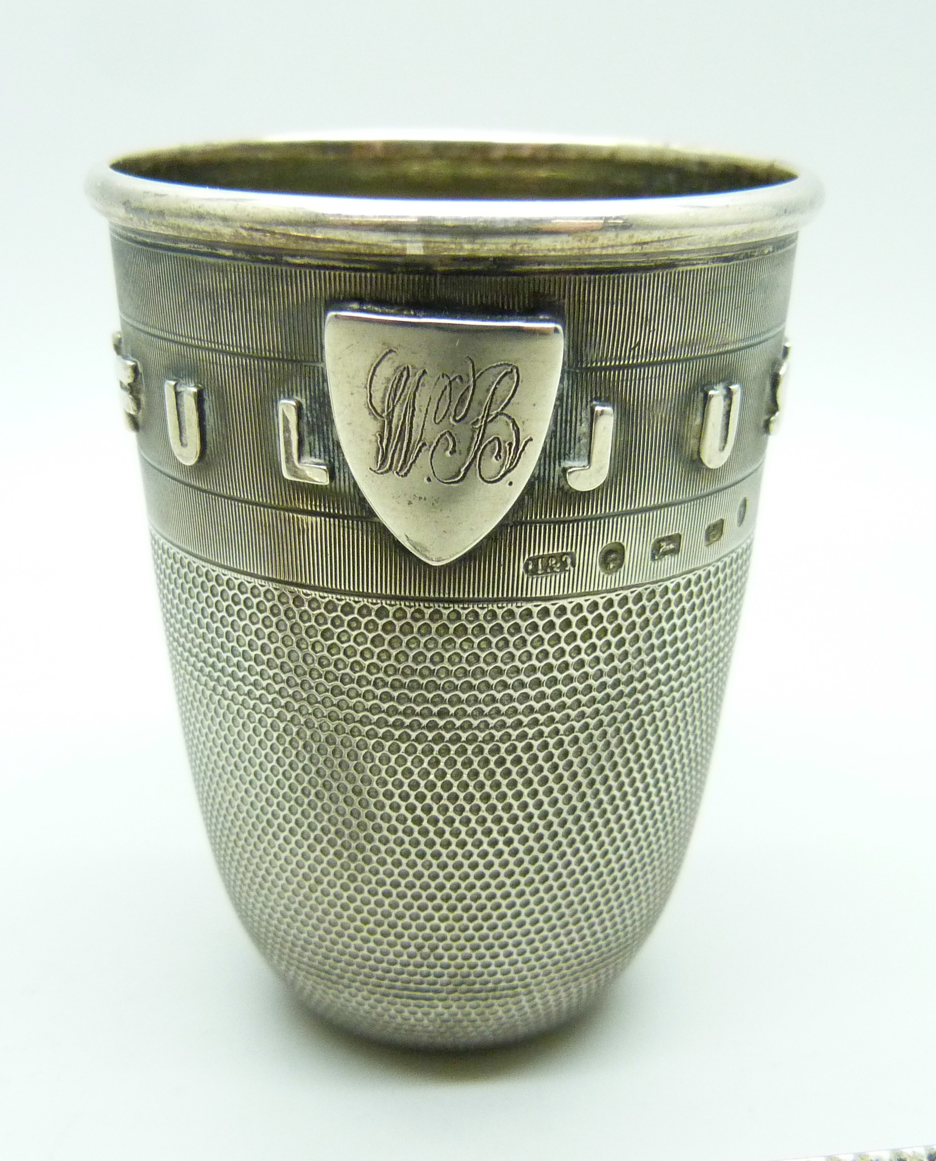 A novelty Victorian silver 'Just a Thimble Full' shot cup with applied shield with initials, - Image 2 of 4