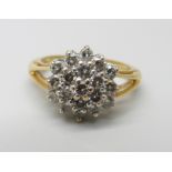 An 18ct gold and diamond cluster ring, 1ct of diamonds marked on the shank, 4.8g, N