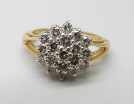 An 18ct gold and diamond cluster ring, 1ct of diamonds marked on the shank, 4.8g, N