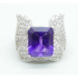 A silver ring with an amethyst and cubic zirconia set wing detail, size Q, by TJC
