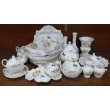 A collection of early Aynsley Cottage Garden china, includes shell shaped dish, three lidded pots,