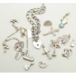 A silver charm bracelet, loose charms and a silver padlock bracelet, 42g