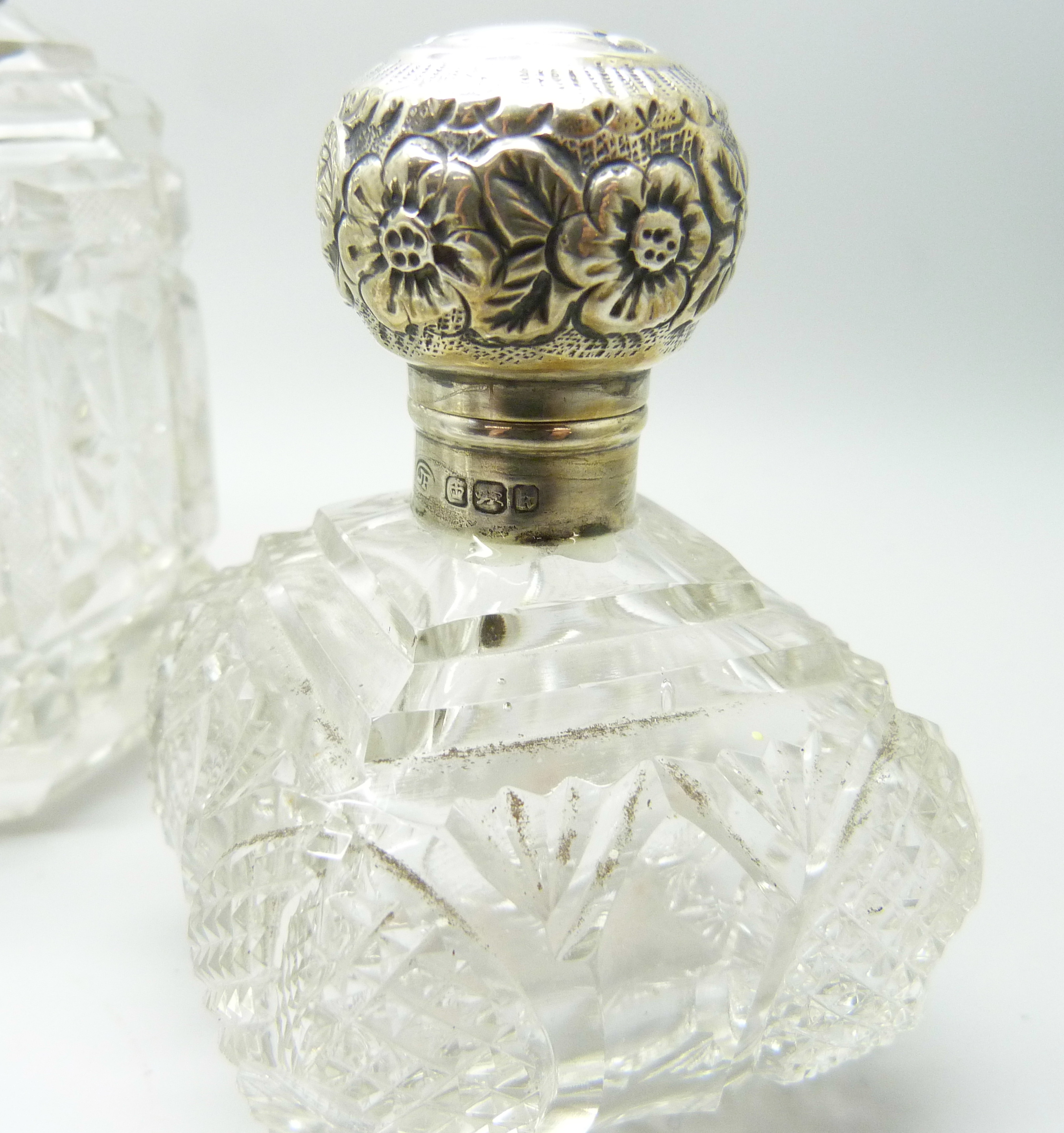 A silver mounted cut glass scent bottle in the shape of a bell, Birmingham 1902, two other silver - Image 2 of 3