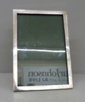 A silver photograph frame, 18.5cm wide