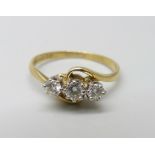 An 18ct gold and three diamond ring, 2.3g, K