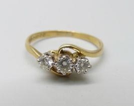 An 18ct gold and three diamond ring, 2.3g, K