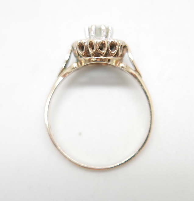 A 9ct gold ring set with a clear central stone and diamond chip halo, 2.2g, O - Image 5 of 5