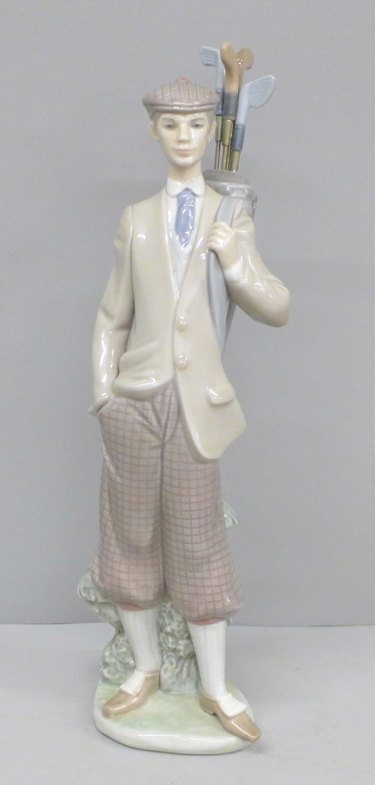 A Lladro figure, Waiting to Tee Off golfer, 1985, boxed