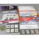 Stamps; GB 1999-2005 commemorative presentation packs in a biscuit box. 70 packs with all stamps
