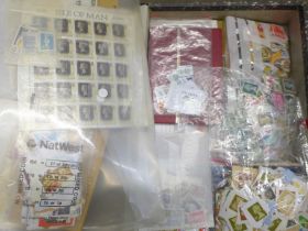 A box file of loose stamps, packs, covers, etc