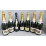 Seven bottles: four De Vallois Champagne, one Bollinger Champagne Special Cuvee and two others