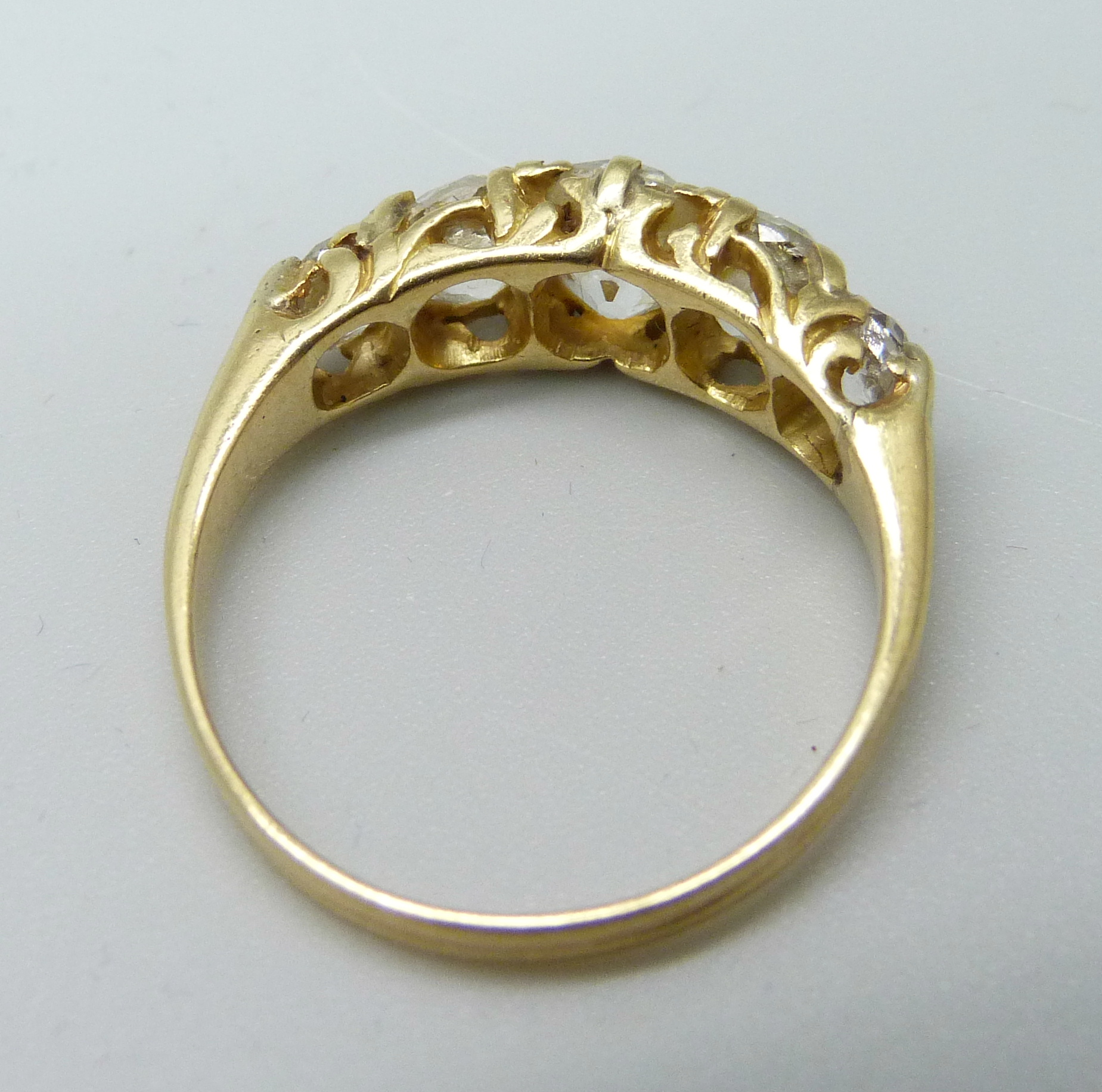 A yellow metal ring, (tests as 18ct gold), set with five old-cut diamonds on a double strand D- - Image 3 of 3