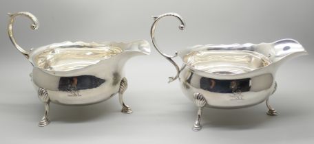 A pair of silver sauce boats, London 1934, marked Harrods, 496g