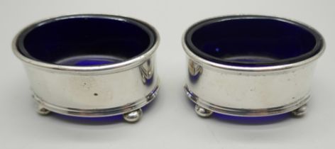 A pair of silver salts with blue glass liners. Birmingham 1923, 37g