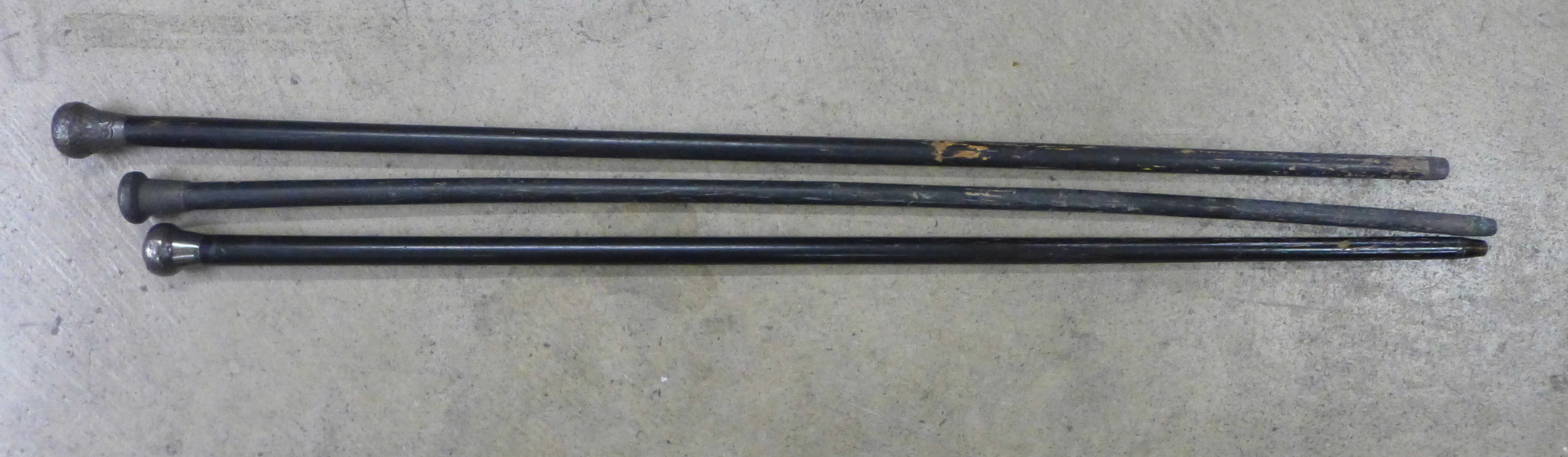 Three silver topped walking canes