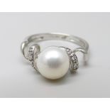 An 18ct white gold, diamond and pearl ring, 2.9g, M/N