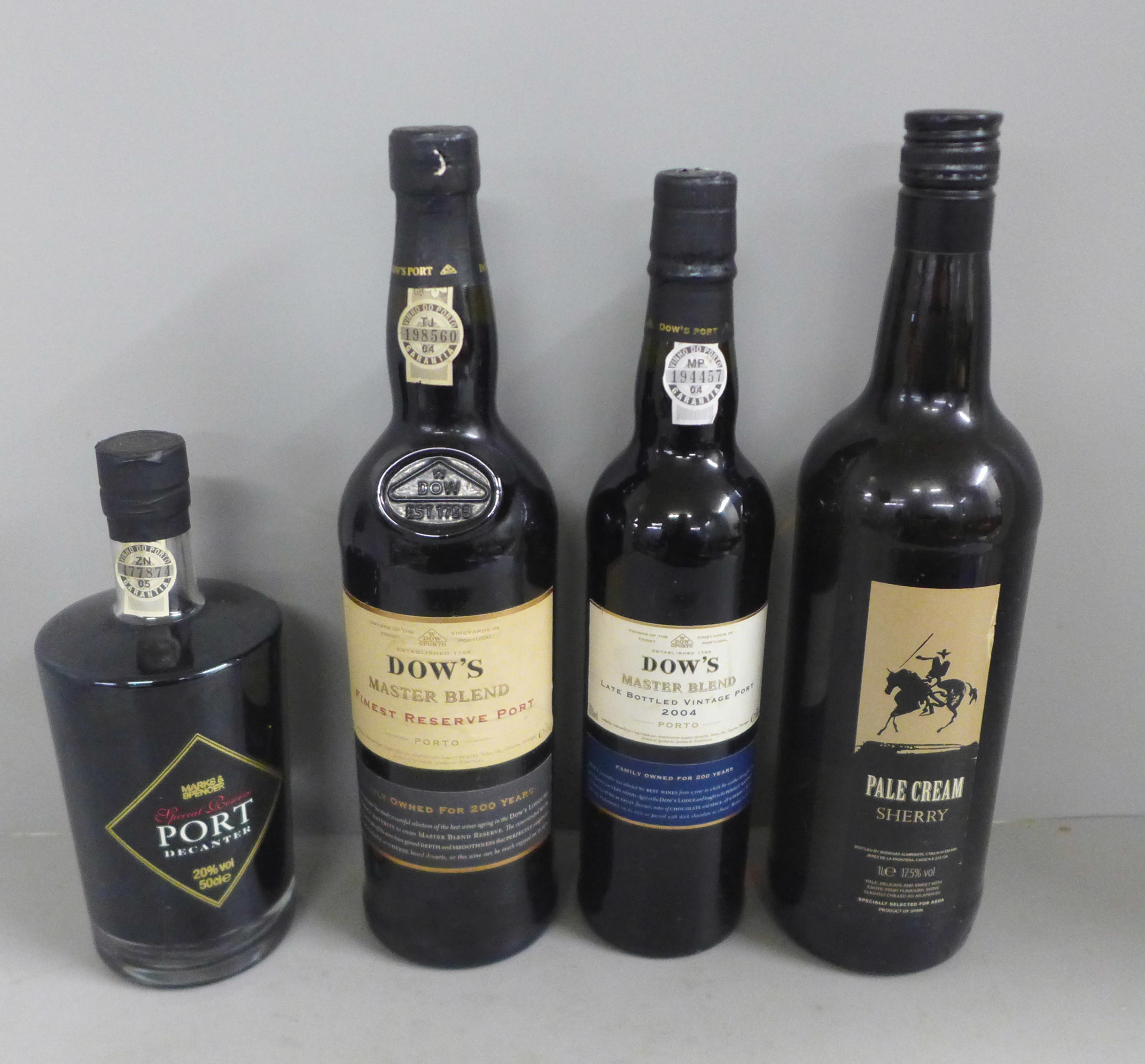 Three bottles of Dow's and M&S port and a bottle of Pale Cream sherry