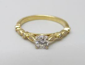 An 18ct gold and diamond ring, 2.6g, M, main stone 0.25ct diamond weight