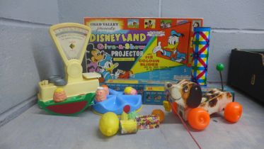 A collection of vintage toys, Disneyland Give-A-Show projector, sweet shop stalls and pretend sweets