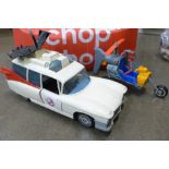 A box of Ghostbusters figures and a model vehicle