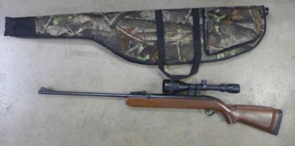 A BSA airsporter air rifle with a 50 scope, Deerhunter bag and a packet of Match Pell pellets