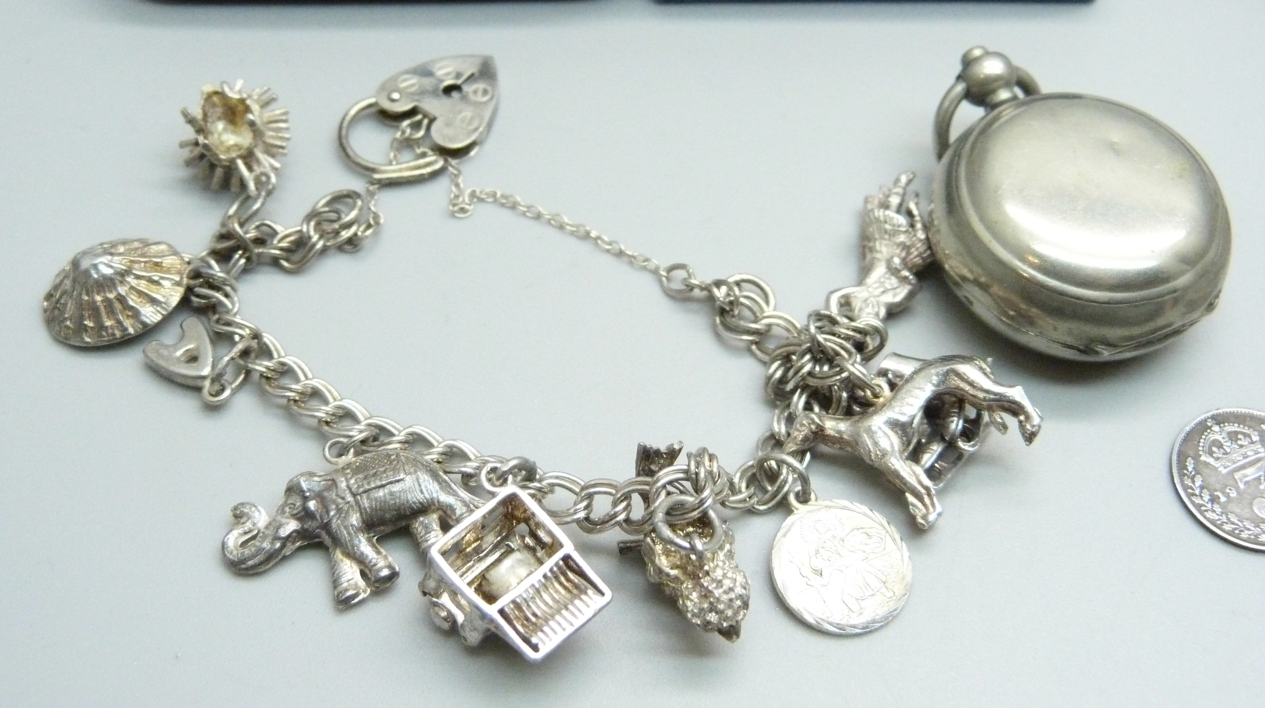 Silver jewellery including four silver bangles and a silver charm bracelet, coins and a sovereign - Image 4 of 6