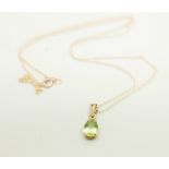 A 9ct gold and peridot pendant and chain, 0.8g, chain 45cm
