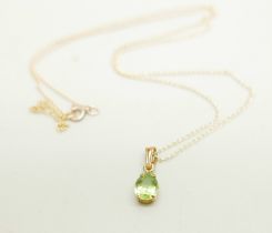 A 9ct gold and peridot pendant and chain, 0.8g, chain 45cm