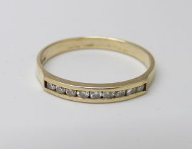 A 9ct gold and nine stone diamond ring, 1.4g, Q