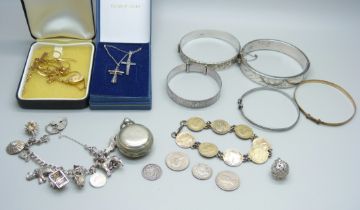 Silver jewellery including four silver bangles and a silver charm bracelet, coins and a sovereign