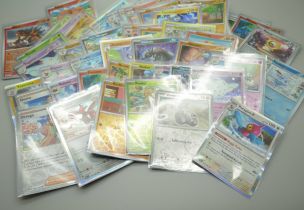 Fifty Holox Rev Holographic Pokemon cards in protective sheets