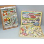 A collection of A&BC Flags of The World Collectors cards and a Victory Road Vehicle puzzle