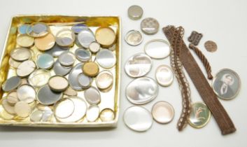 A collection of Victorian brooch inserts, in memory of photographs, hair, etc.