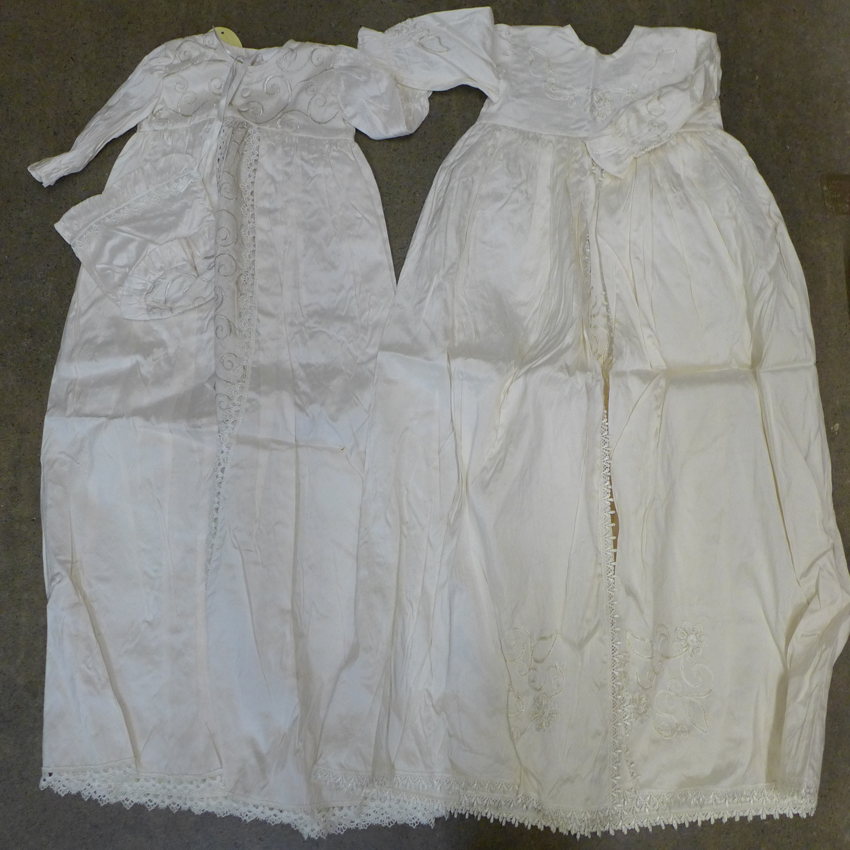 Six silk christening gowns, some with tags by Christine Ann