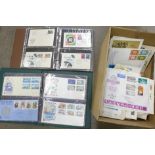 A box of stamps, worldwide first day covers in albums and loose