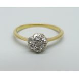 A yellow metal and diamond daisy cluster ring, 2.3g, P