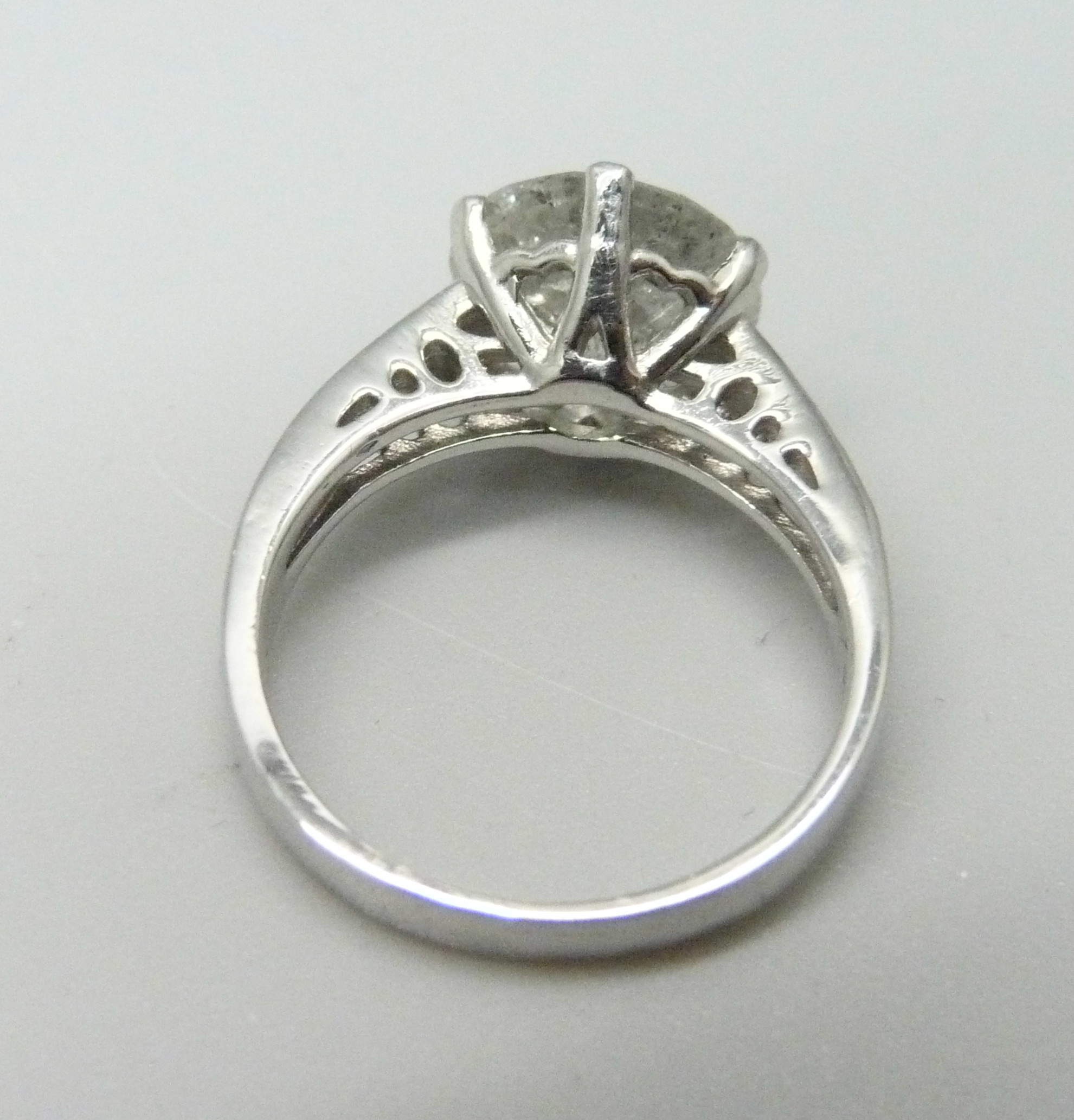 A hallmarked platinum solitaire diamond ring with diamond set shoulders, 3.80cts, 6.2g, M - Image 4 of 4